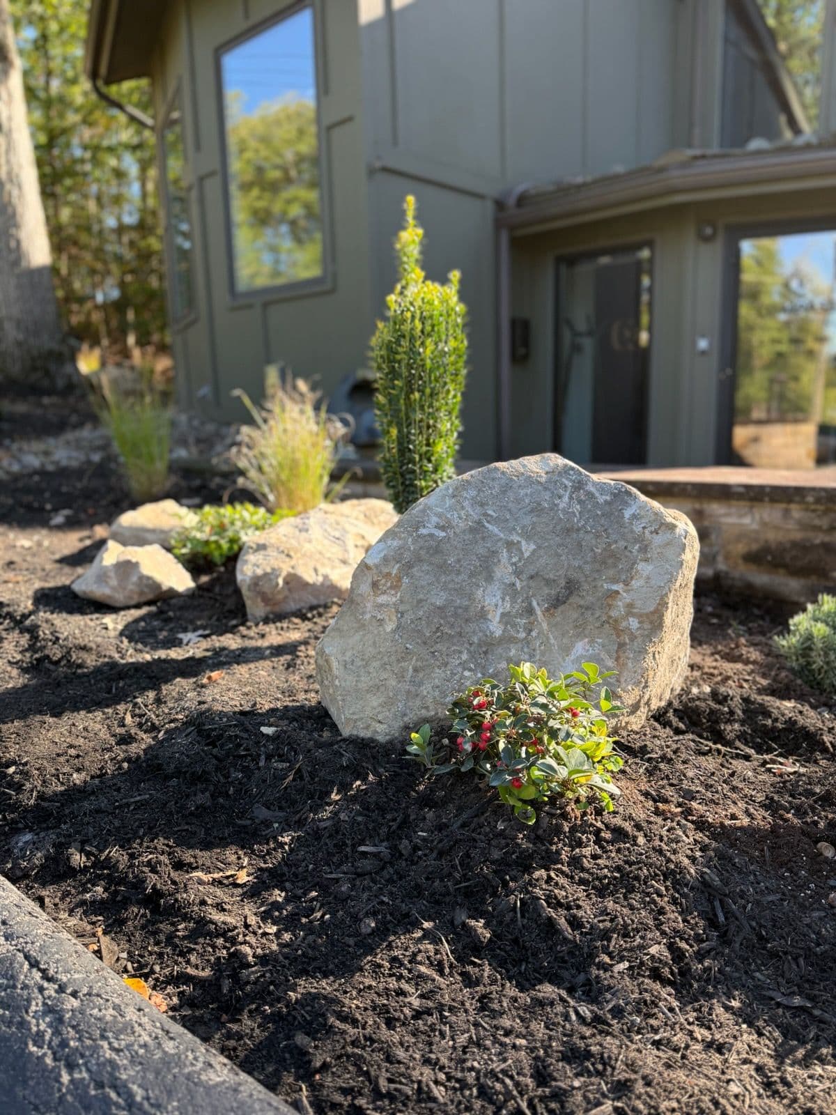 Front Garden Enhancement with Boulders and Skyrocket Holly image