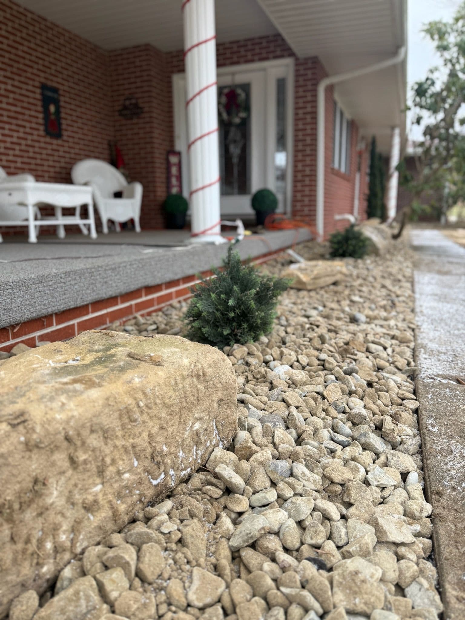 Transform Your Porch with Expert Gravel and Boulder Installation image